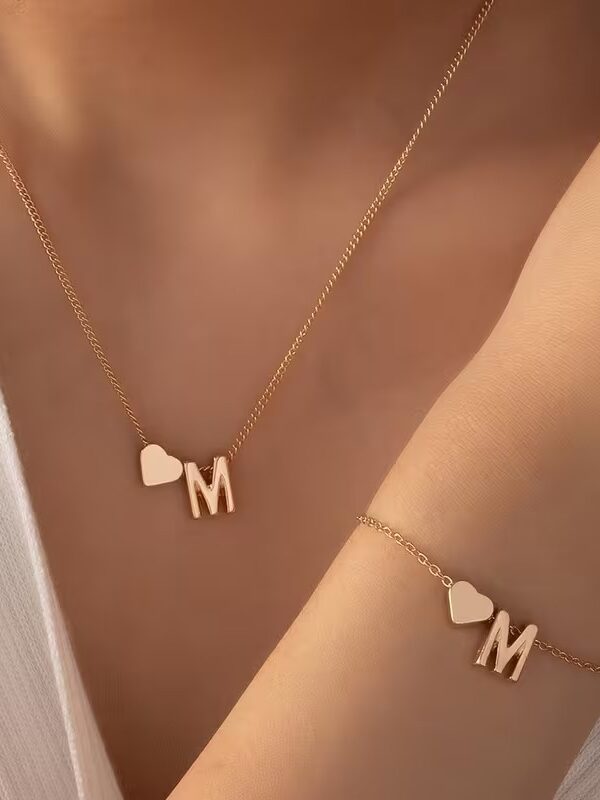 iniciales+ corazon. collar , pulsera pasante  acero dorado, todas la letras. las cadenas son tipo comercial