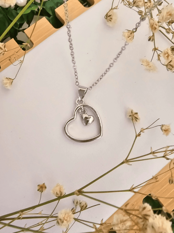 2025/03/1001017360.png collar corazon con mini corazon colgante plateado