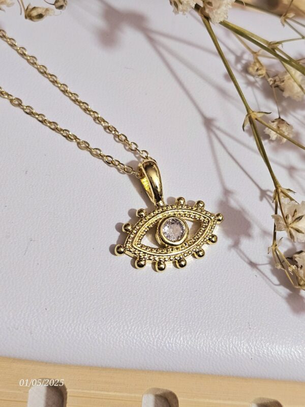 2025/05/1001174633-scaled.jpg collar ojo dorado