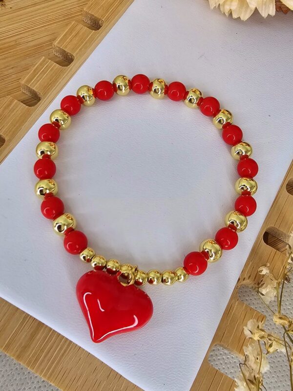 2025/06/IMG-20250530-WA0146-scaled.jpg pulsera billas corazon rojo dorado