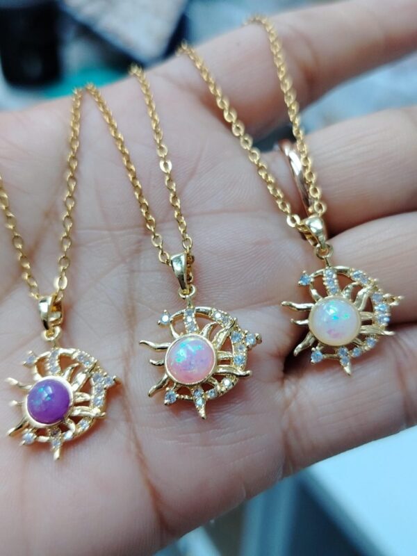 dije sol luna dorado acero