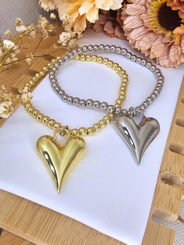 2025/06/IMG-20250611-WA0005-scaled.jpg pulsera billas corazon chunky dorado