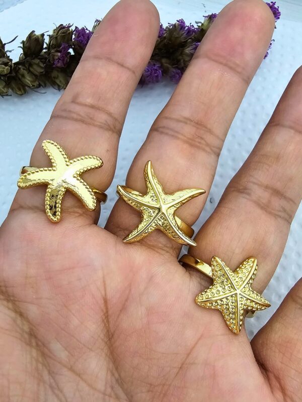 Anillo estrella de mar acero dorado regulable