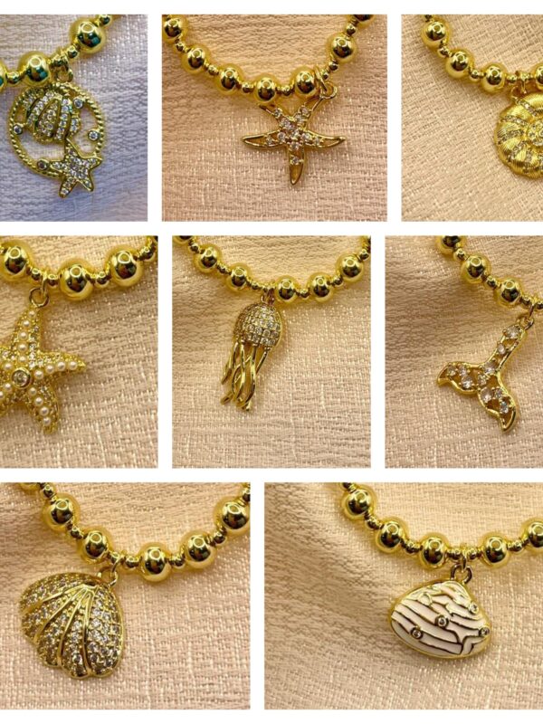 2025/08/1001540526-scaled.jpg pulsera marinas billas caracol, concha, Medusa, cola de sinera, estrella de mar dorado