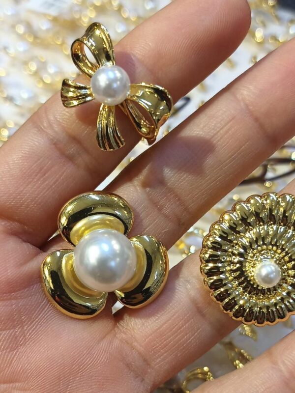 anillos flores, lazo, caracol marino acero dorado regulable