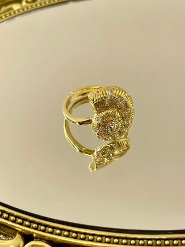 Anillo caracol acero dorado regulable