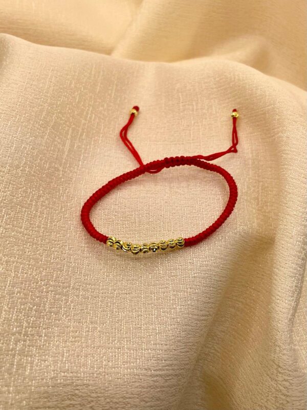 pulsera hilo rojo billas dorado