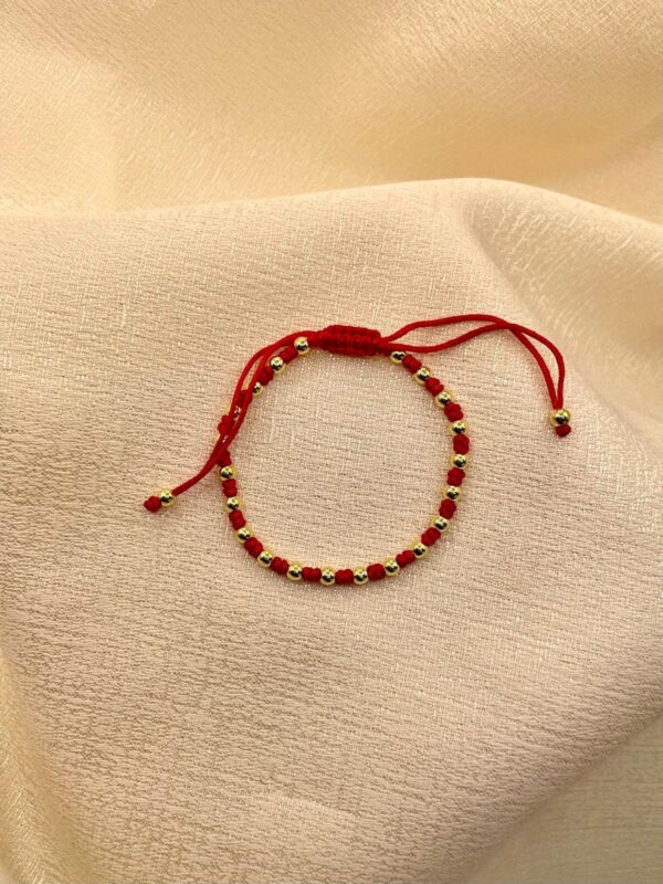 2025/09/IMG-20250814-WA0138.jpg pulsera hilo rojo dorado