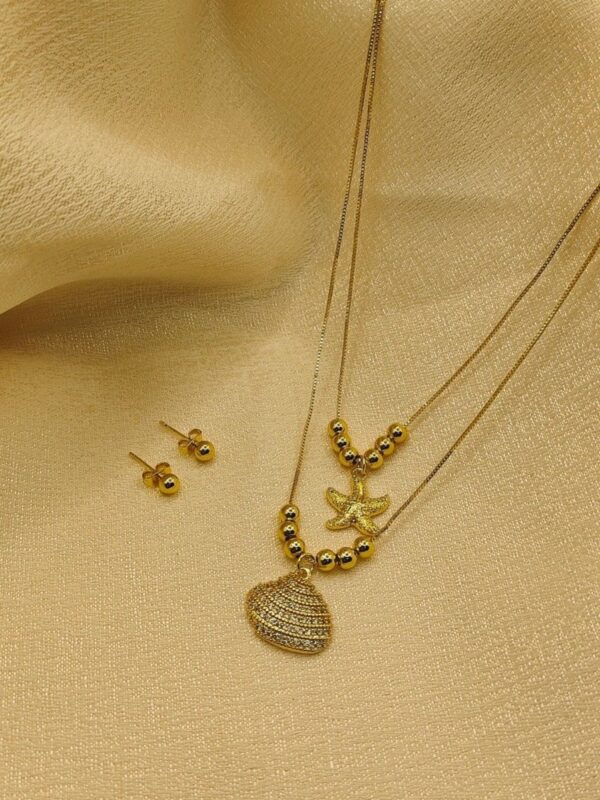 2025/09/IMG-20250908-WA0079.jpg set marino doble caida estrella concha de mar dorado