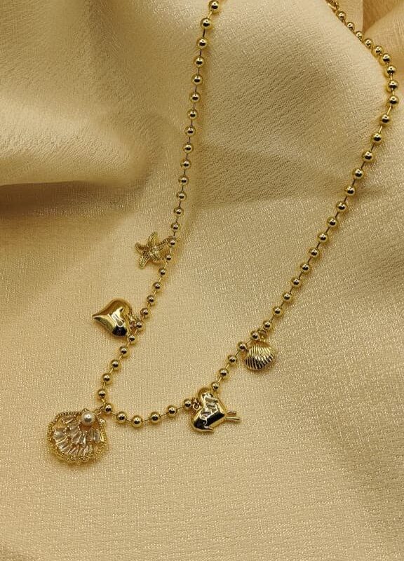 2025/09/IMG-20250908-WA0086.jpg collar marino billas estrella concha de mar coraozon dorado