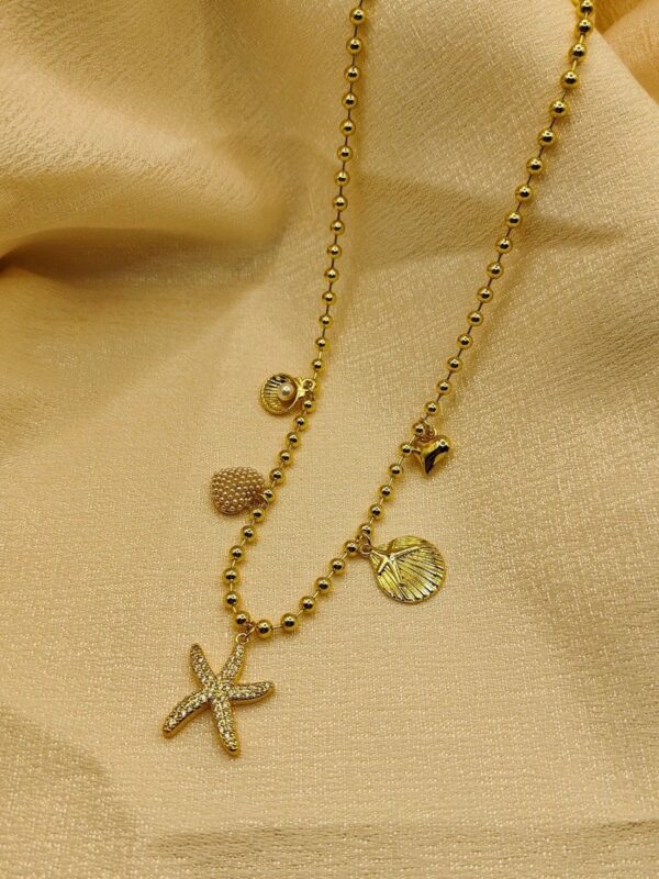 2025/09/IMG-20250908-WA0094-1.jpg collar marino billas estrella concha de mar corazon dorado