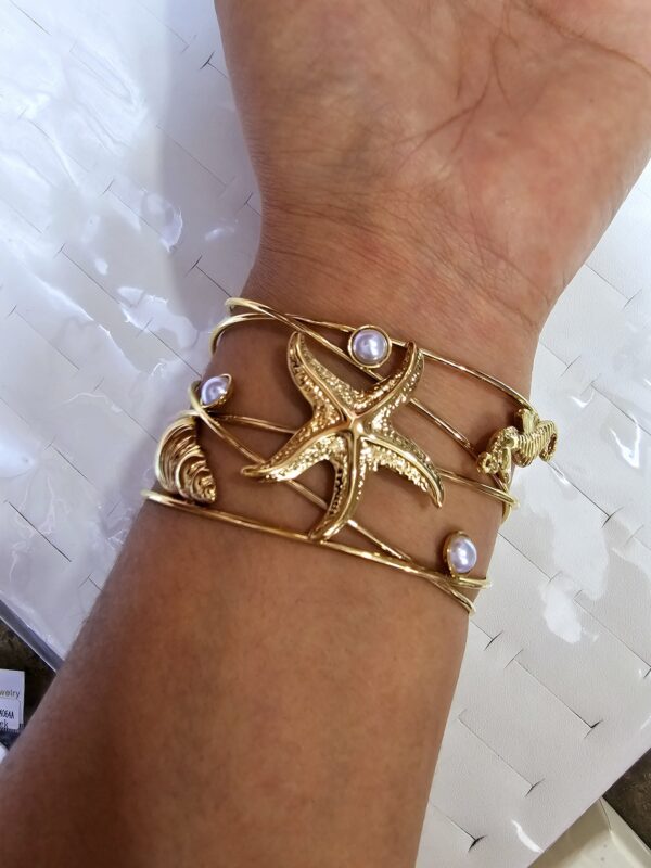 pulsera brazalete estrella, caracol, caballito de mar doble enchape acero 316* dorado