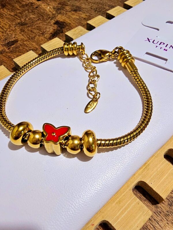 Pulsera pandora con dijes xuping  TTM acero inoxidable dorado