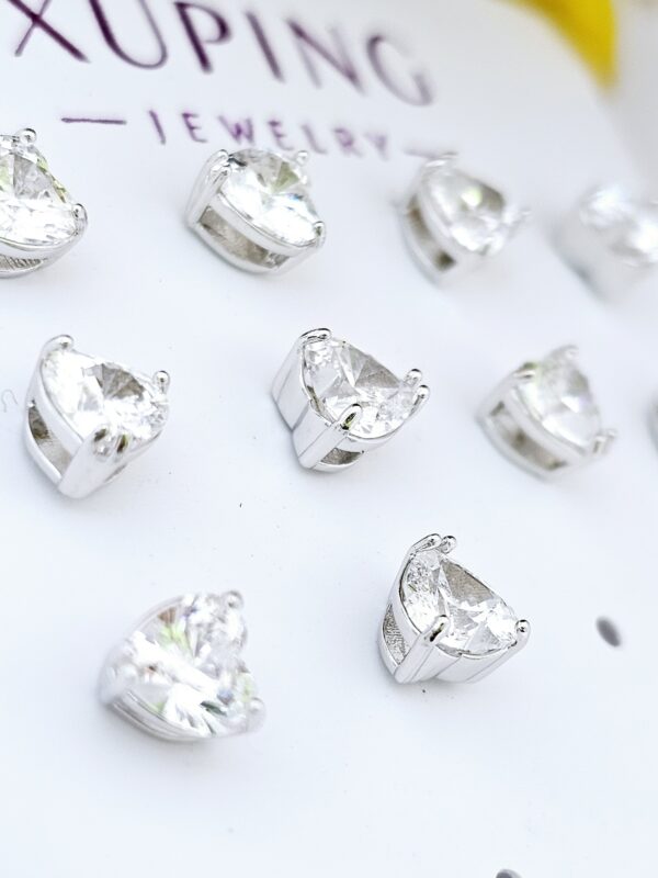 2025/12/1001936440-scaled.jpg arete 5mm corazon punto de luz xuping jewerly plateado