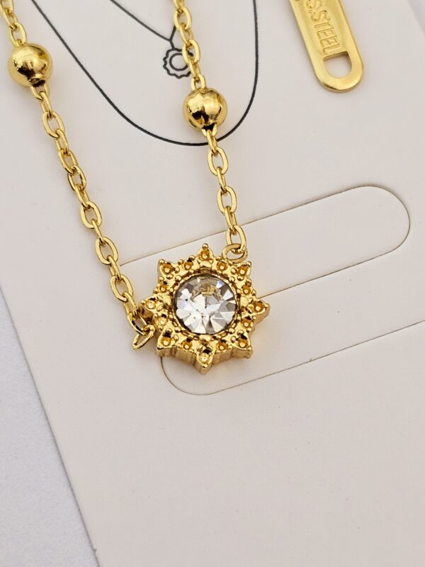 collar sol billas acero dorado