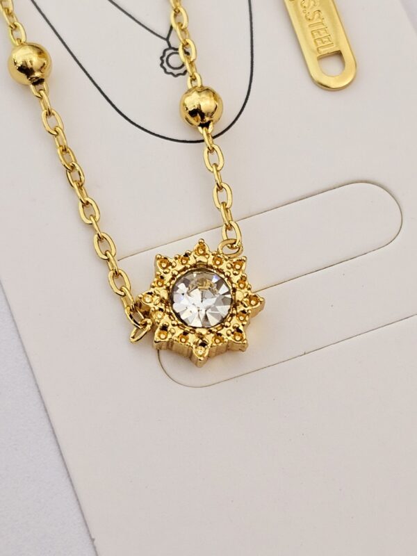 collar sol billas acero dorado