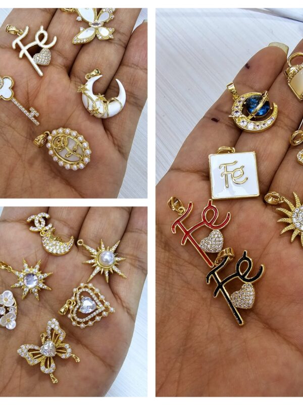 dijes acero fe, llave, mariposa luna, sol, planeta. corazon, réplica,  estrella , acero dorado