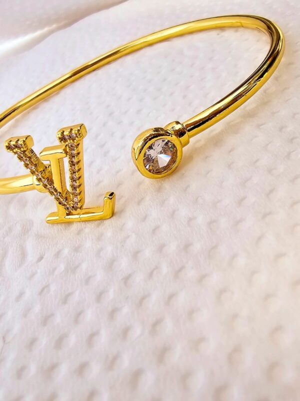 pulsera réplica acero dorado regulable