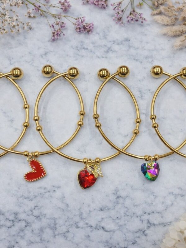 3fe90899-ab64-4174-ae86-a8b5b5417797 pulsera regulable corazones acero dorado