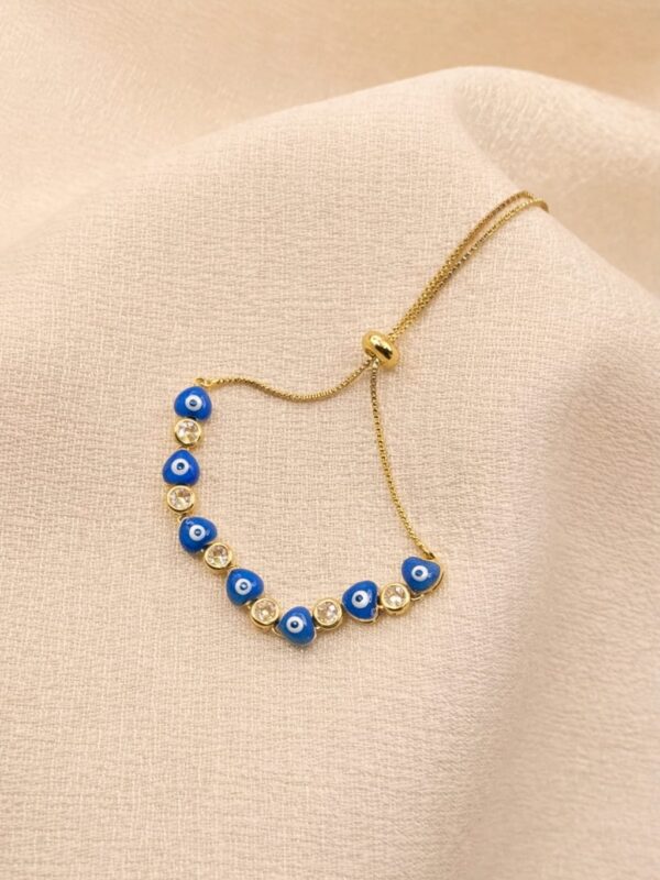 dbaee874-021b-481e-81f2-3c442aae9352 pulsera regulable ojo turco corazon azul rodio dorado