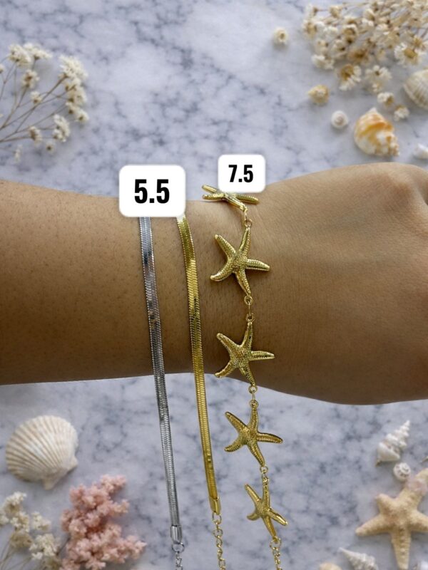 pulsera marninas, serpiente plana  de acero dorado y plateado