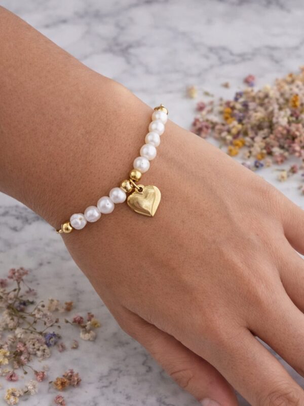 Pulsera regulable perlas de rio natural acero dorado