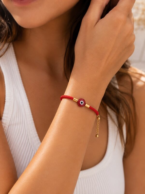 WhatsApp Image 2026-08-06 at 6.58.26 PM pulsera cordon rojo rodio dorado ojo turco + extension. hilo