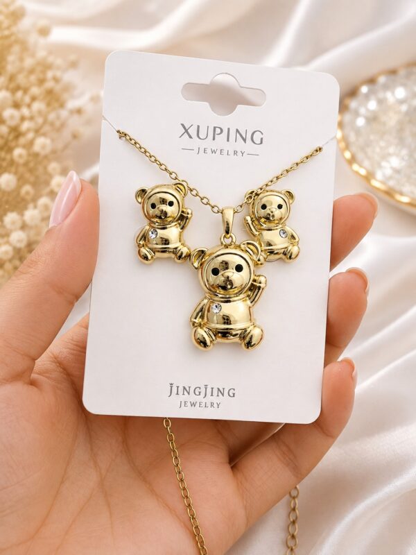 b414cc97-9ffe-4c83-9431-ae6a471761f1 juego oso collar +aretes dorado xuping jewerly
